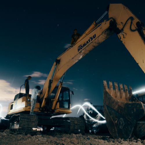 komatsu excavator night construction site