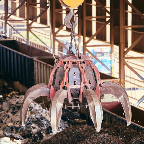 scrap metal grab claw recycling yard