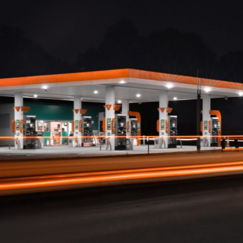 service station forecourt night light trails